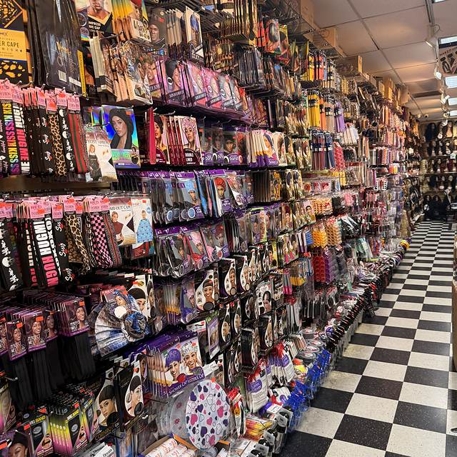 Accessories wall at Beauty Time with bonnets, caps, combs and brushes