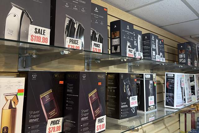 Barber supply shelf at Beauty Time with Andis and Wahl clippers, trimmers and shavers