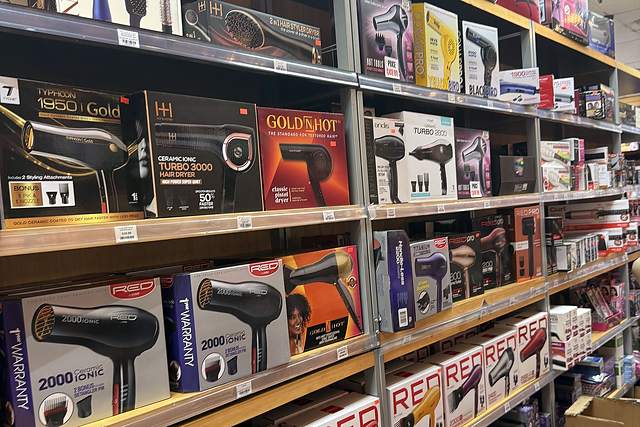 Blow dryers, flat irons and styling tools on the shelf at Beauty Time